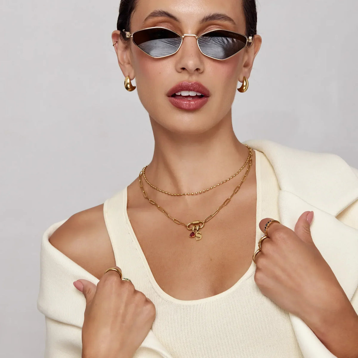 Gold carabiner charm lock necklace worn on model — Olivia Jewelry